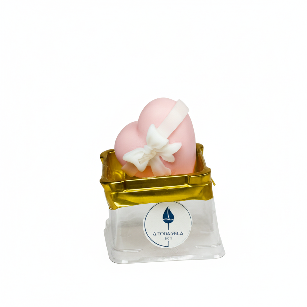 Vela Corazón de Regalo rosa pálido, souvenir de lujo para Primera Comunión de niña. Detalle elegante 100% ecológico presentado en caja dorada.